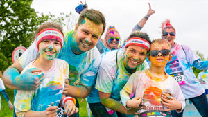 Family with kids after a Colour powder event in a Canadian city