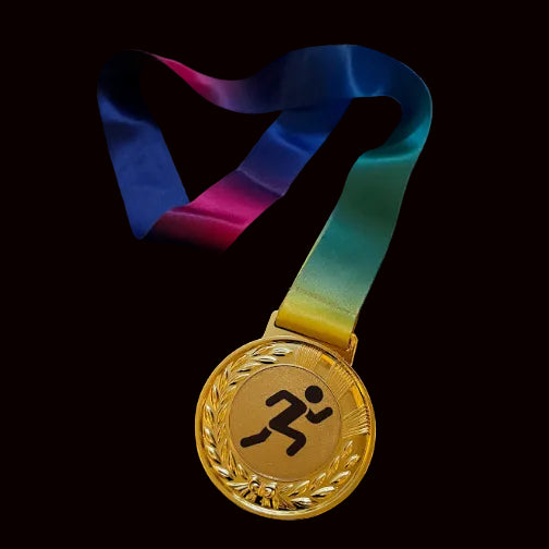 Gold medal with a colorful ribbon on a dark surface