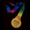 Gold medal with 'BRAVO!' text and a rainbow ribbon on a dark background
