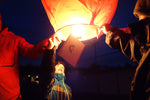 Load image into Gallery viewer, people launching a christmas lantern
