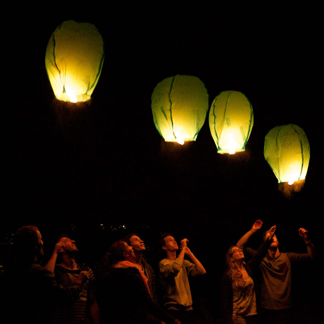 chinese lanterns floating in the sky